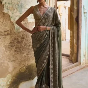Kanjivaram saree with an intricate zardozi border, paired with a fully embroidered zardozi blouse and a complementing mukaish embroidered patka.